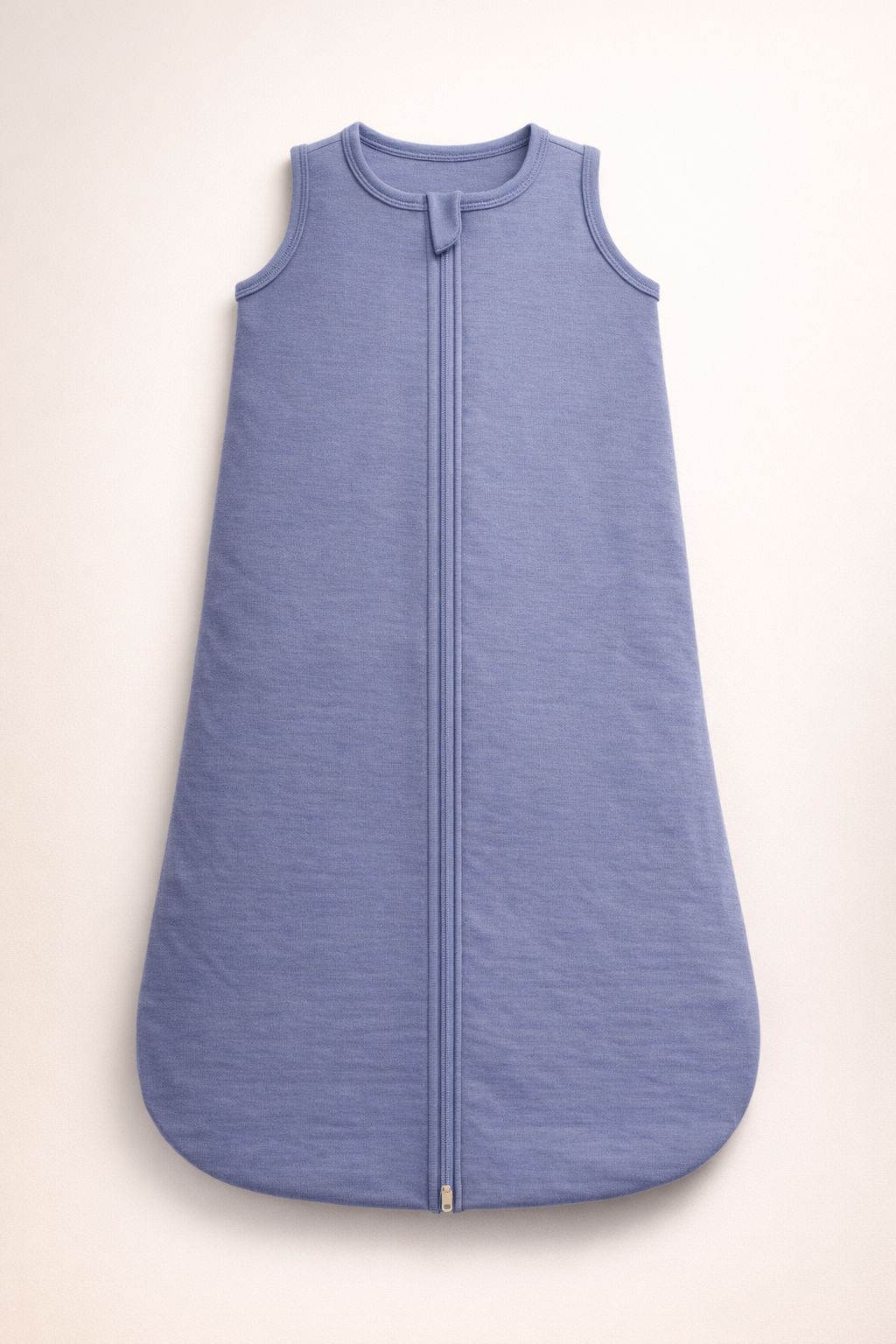 Blue sleeveless jacket with a zipper on a beige background